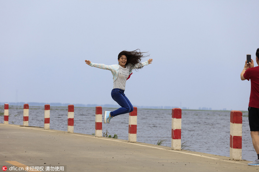 Walking along a 'water' highway on Poyang Lake