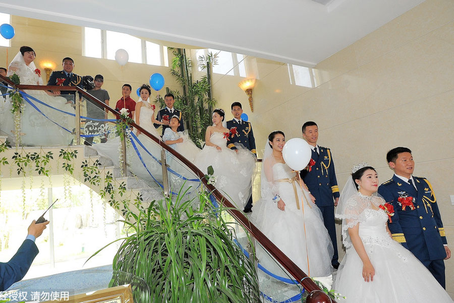 Military-style wedding: Fighter jets, grooms in dashing uniforms