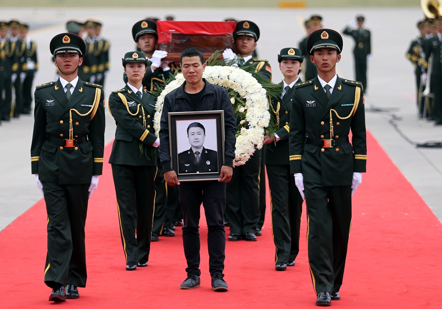 Peacekeeper's body returns for burial