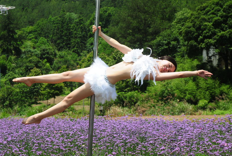 Pole dancing in sea of flowers