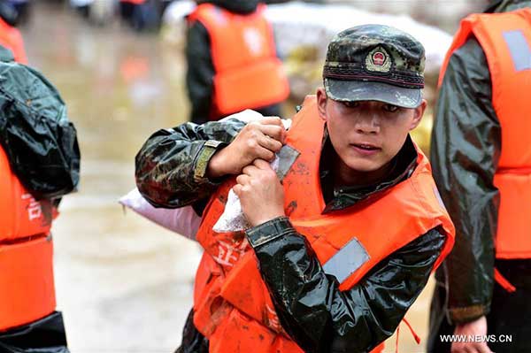Xi orders more troops to join flood control