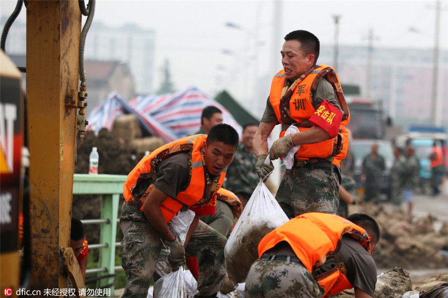 Remember emerging heroes in China's floods