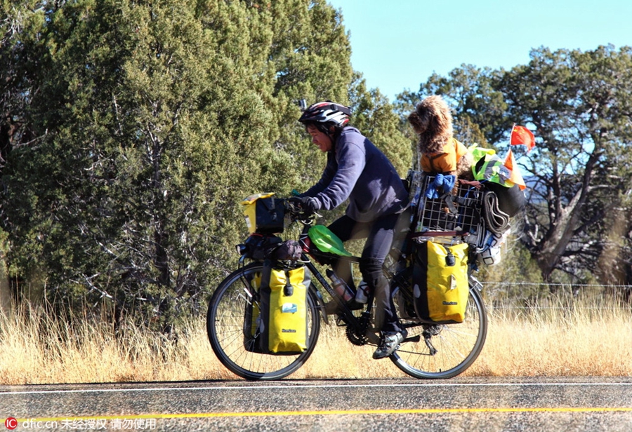 Man cycles the world with his dog to support animal care