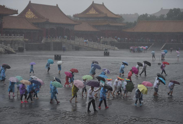 Beijing issues orange alert for heavy rain, train, flights delayed