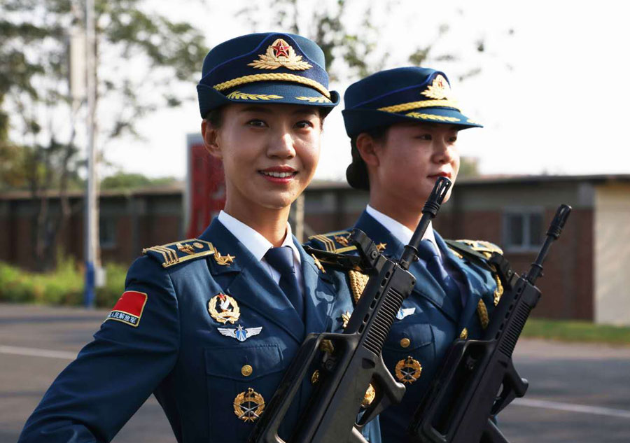 Marching with honor: Women soldier carrying the flag