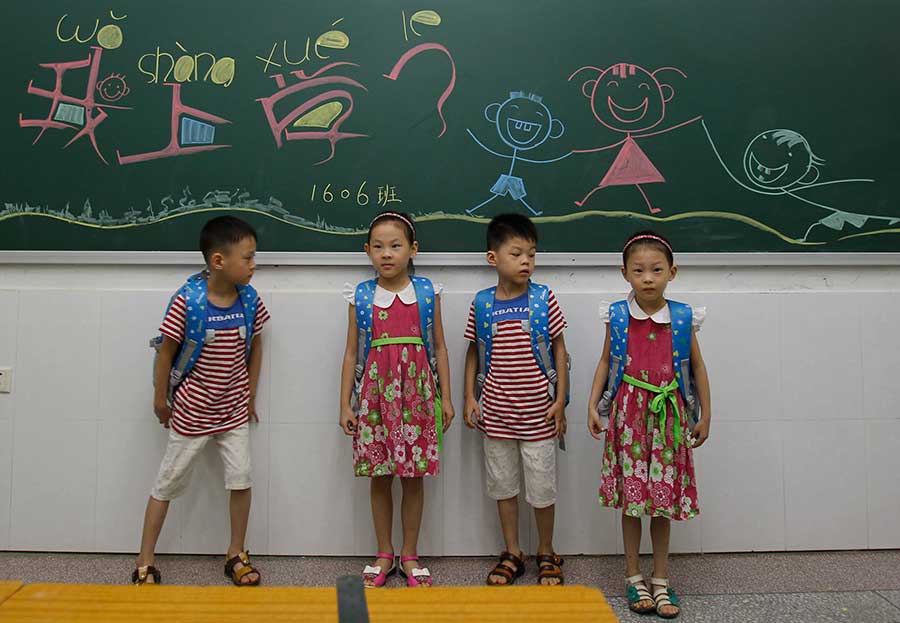 Four of a kind: Quadruplets get ready for school in Changsha