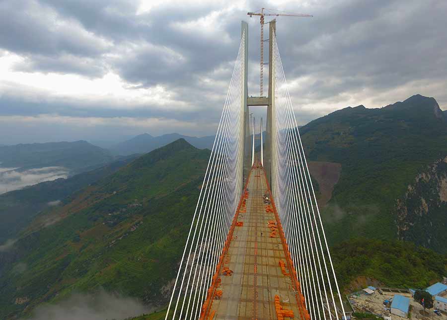 Main span of highest bridge completed in SW China