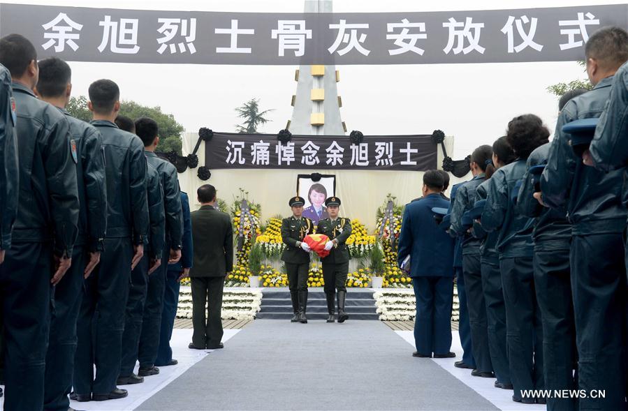 Ashes of fallen pilot placed in hometown cemetery