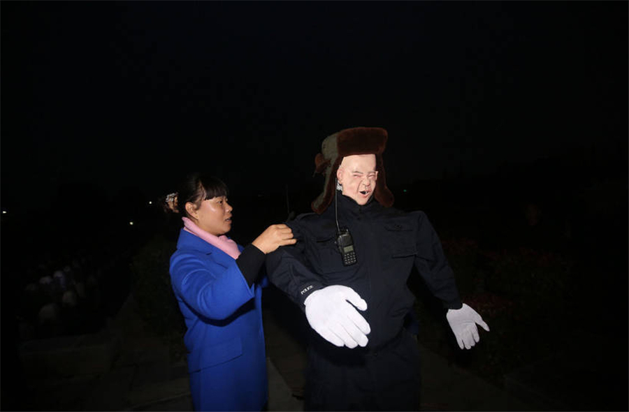 Cemetery in central China deploys creepy robot guard to escort female patrol guards at night