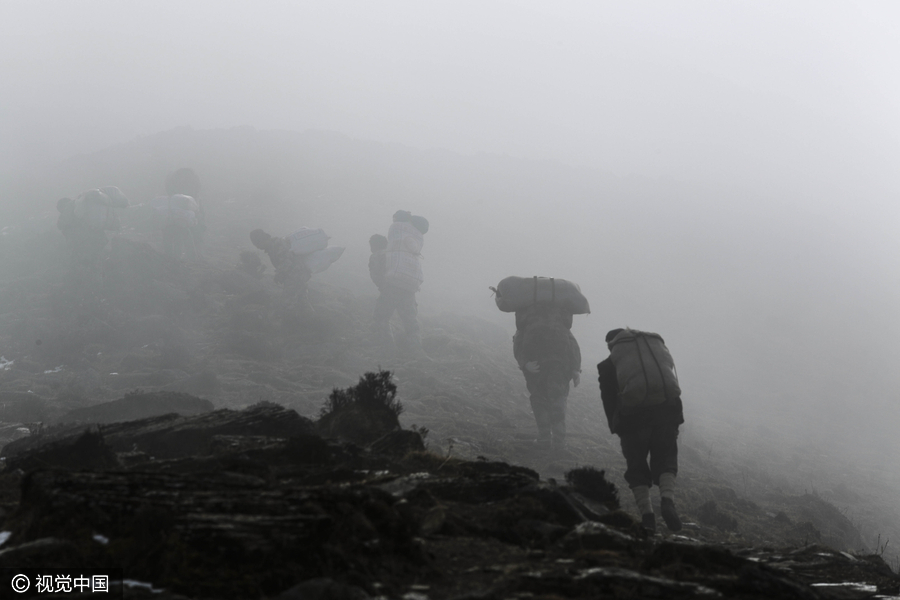 The hard and worthwhile life of anti-poaching patrol team in SW China