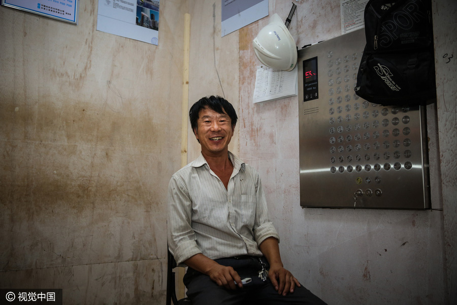 Workers behind Beijing's tallest building