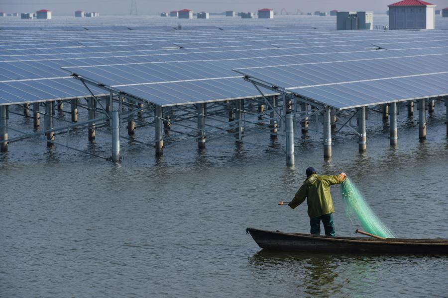 Solar power project under construction above fishery water