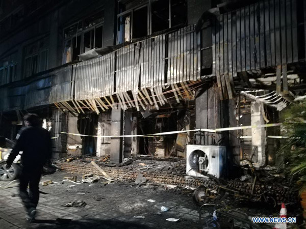 Fire at China massage parlor kills 18