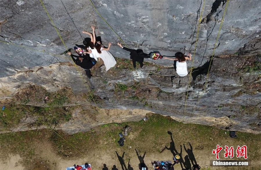 Taking love to new heights with special cliffside wedding photo