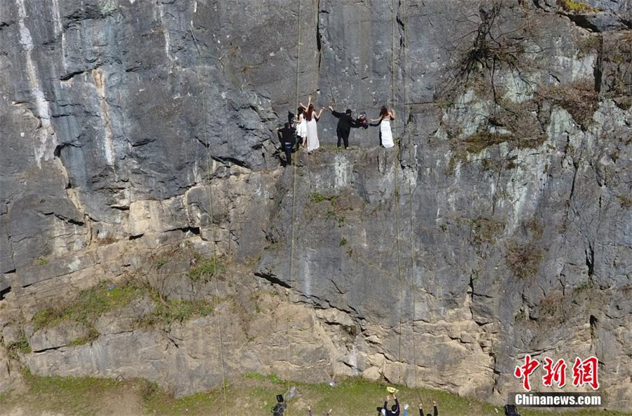 Taking love to new heights with special cliffside wedding photo
