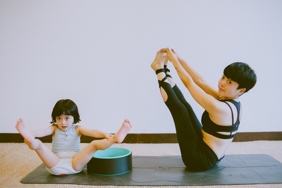 Little yogi practices yoga with 'guru' mother