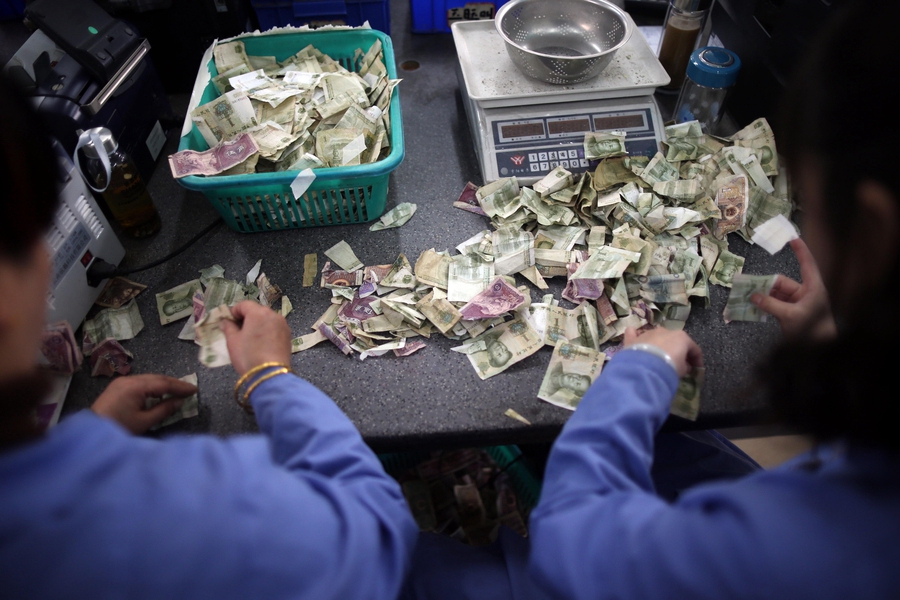 Cramped fingers, 24-hour security and sticky tape all part of a money counter's job