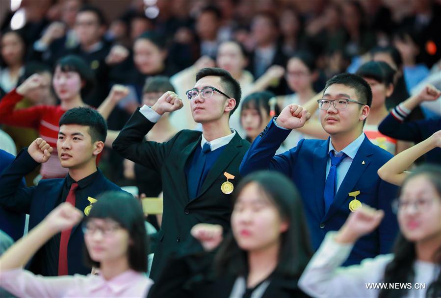 Students cheer at adult ceremony in North China