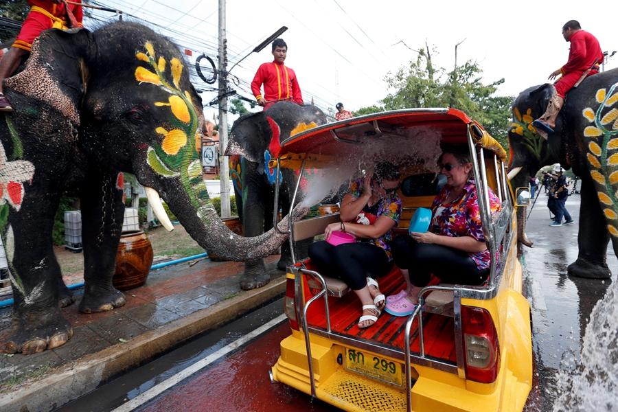 Celebrants mark festival by making a splash