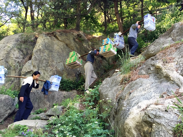 Porters see a steep drop on Taishan Mountain