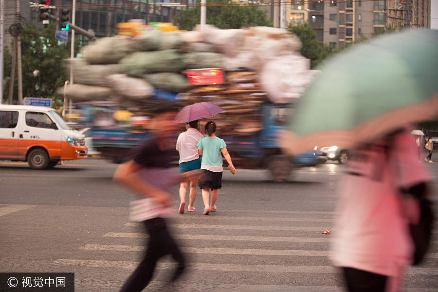 Heavy rains bring respite to scorching Beijing