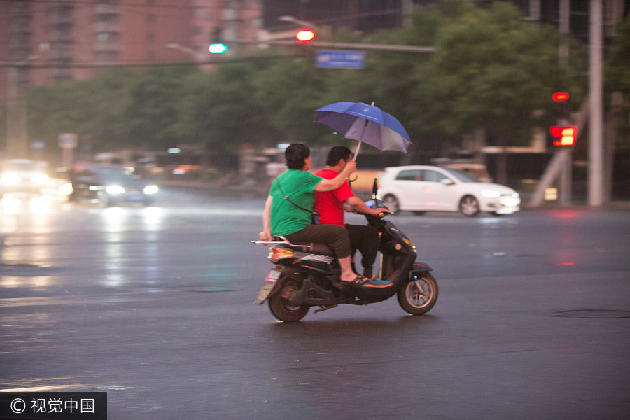 Heavy rains bring respite to scorching Beijing