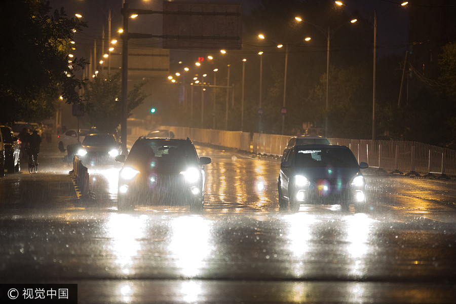 Heavy rains bring respite to scorching Beijing