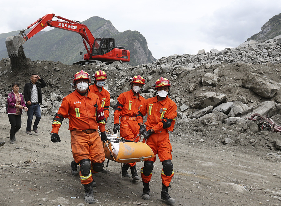 Rescue work underway after SW China's devastated landslide