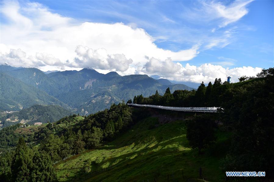 People enjoy scenery at high altitude sight-seeing footpath in Taiwan