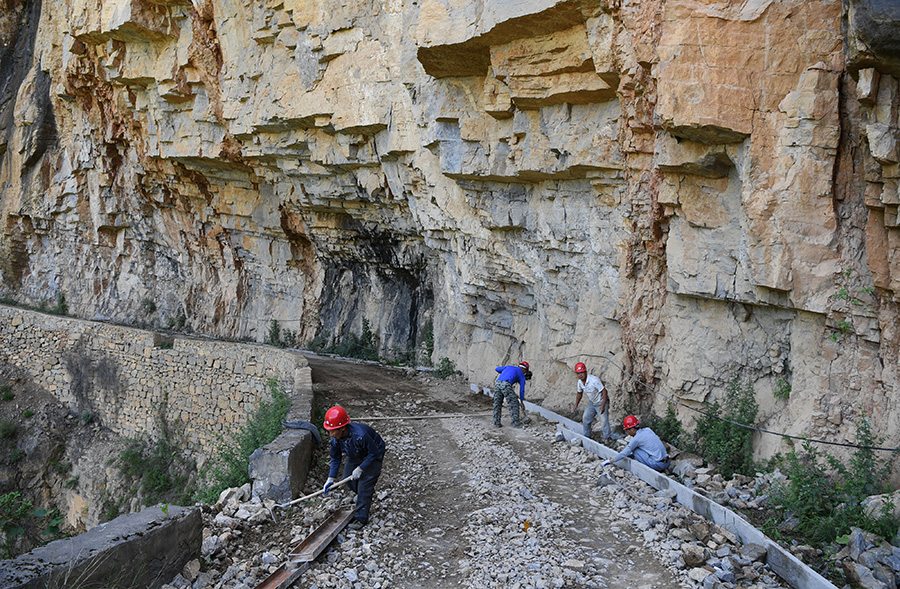 Villagers create path to prosperity by carving out mountain road