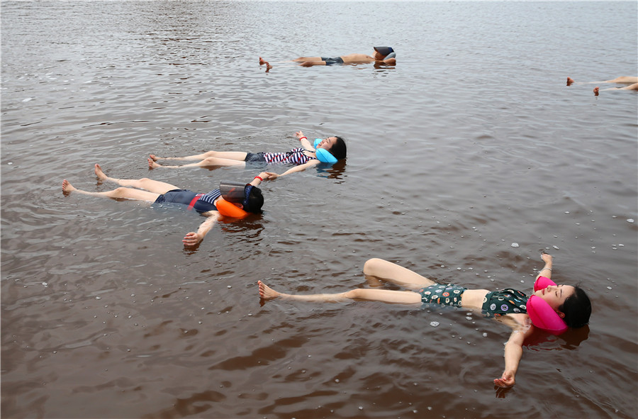 Swimmers float in 'Dead Sea' in Dalian