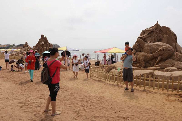 Beach goers impressed by sand sculptures
