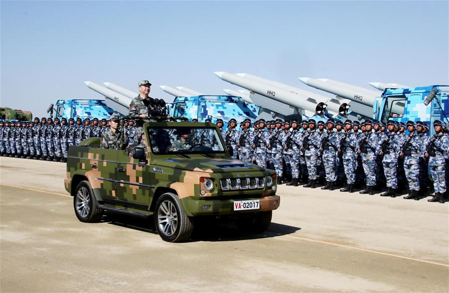 Xi reviews parade in field for first time