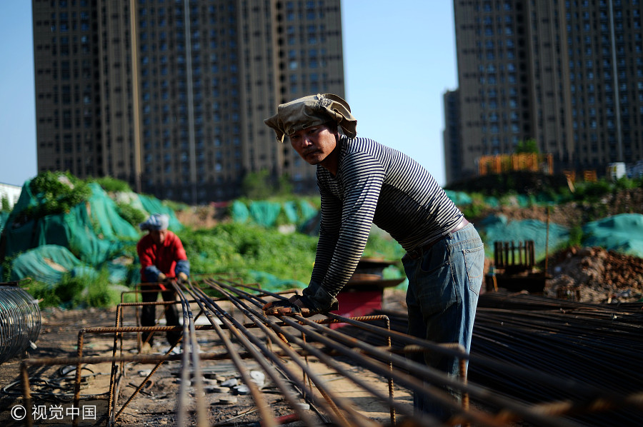 Welders cover up despite summer heat