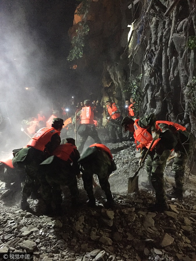 Rescuers work overnight to save quake victims