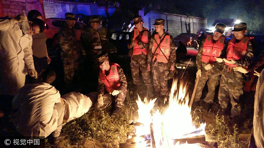 Rescuers work overnight to save quake victims