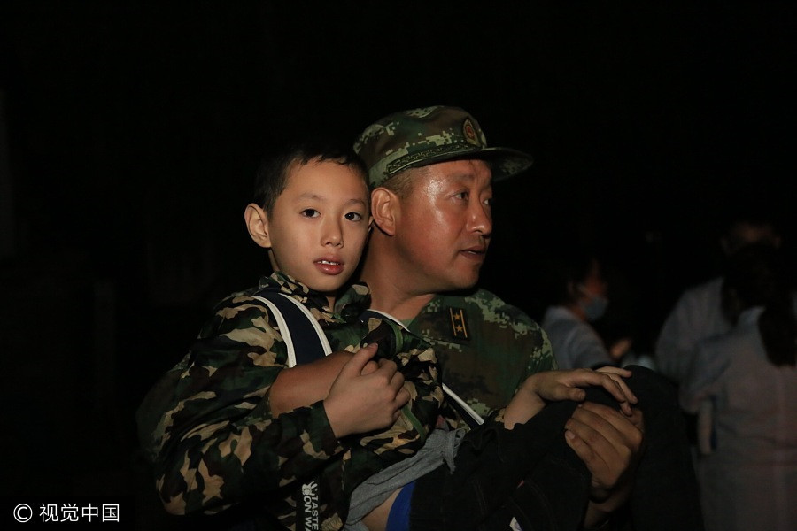 Rescuers work overnight to save quake victims