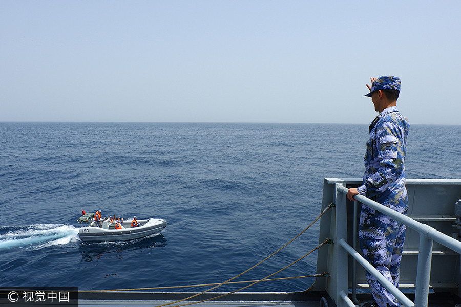 Navy sailors tie knot in middle of sea