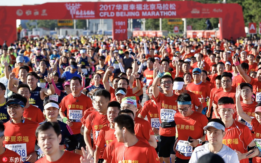 Runners compete during 2017 Beijing Marathon