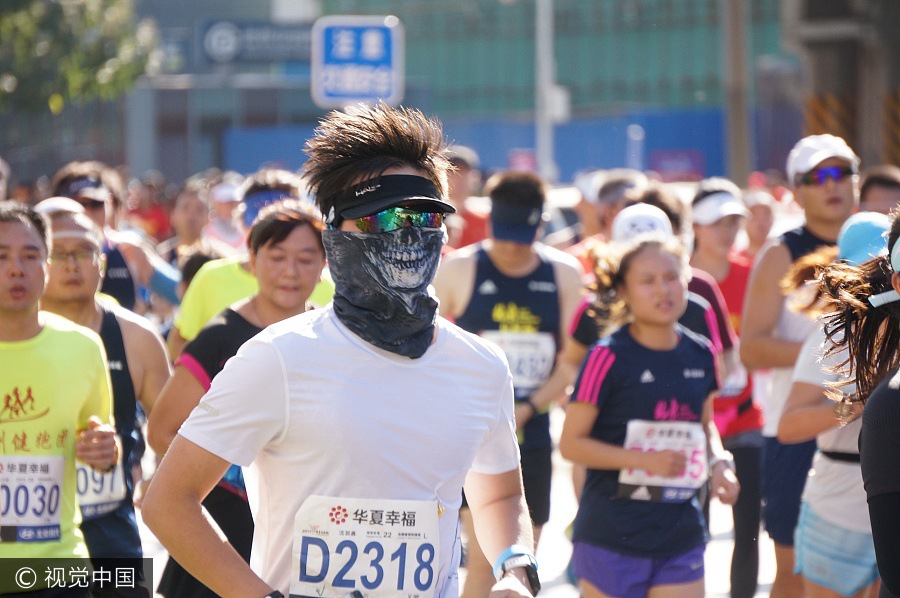 Runners compete during 2017 Beijing Marathon