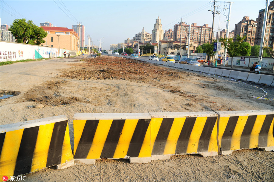 Shanghai house in road torn down after 14-year battle