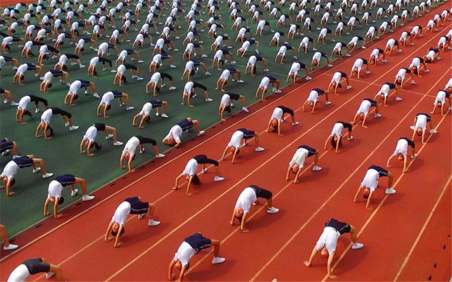 Students practice martial arts during class break