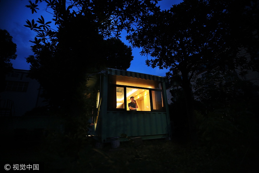 Businessman makes home in container