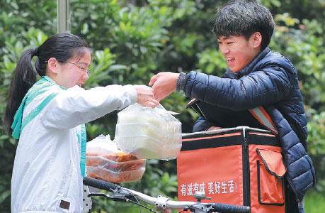 Deliveryman trades his takeout for textbooks