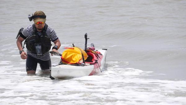 Man kayaks along China's coastline