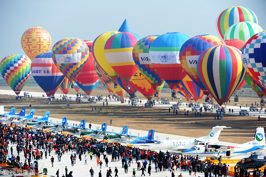 100 couples exchange vows in the air