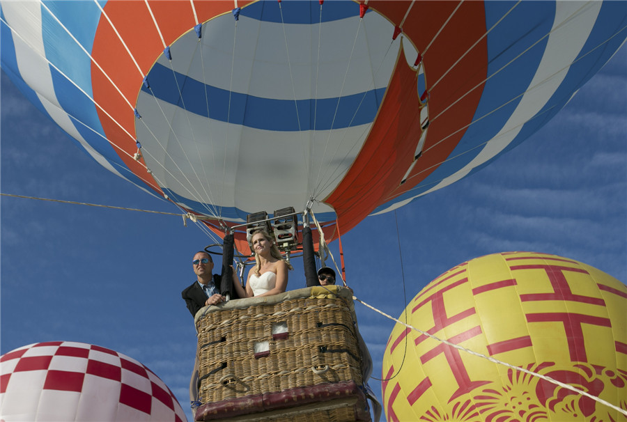 100 couples exchange vows in the air