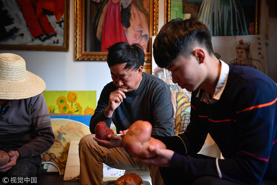 60-year-old villager paints potatoes for a living