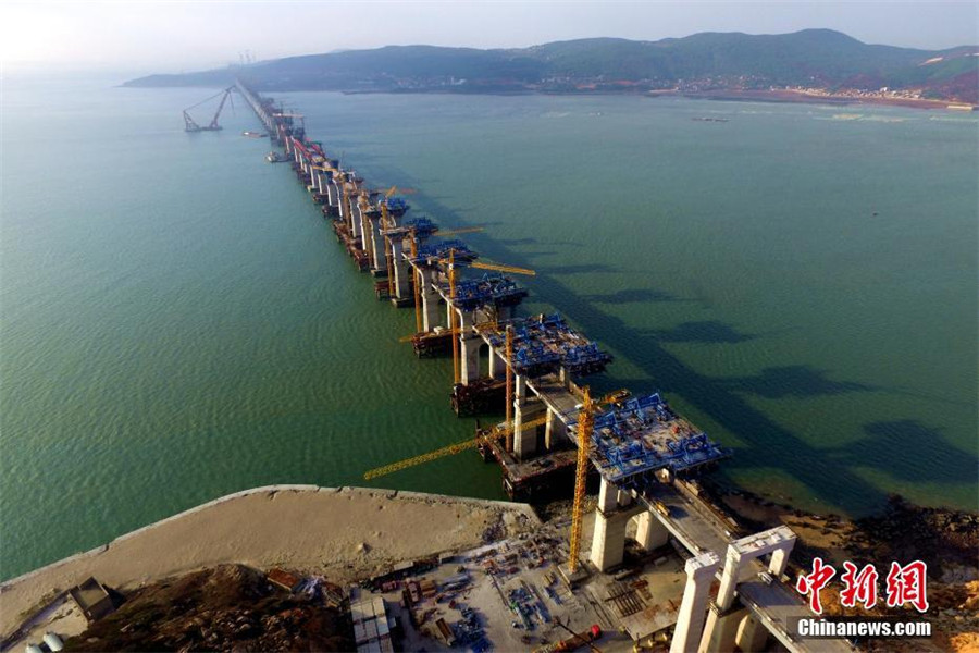 China's first cross-sea rail-road bridge takes shape