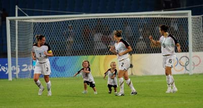 Playing with mum on pitch